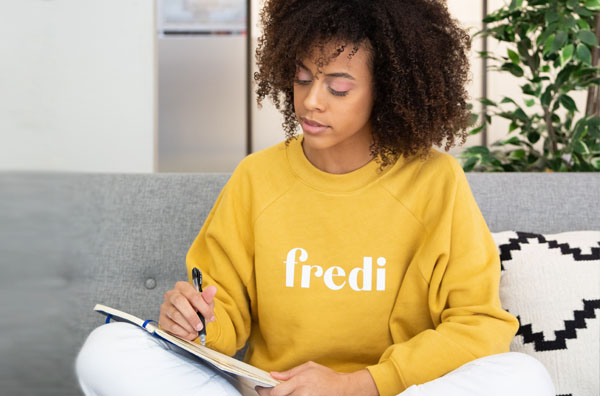 woman writing in journal